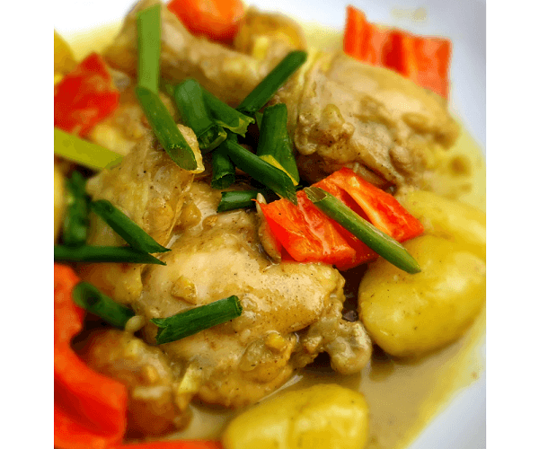 a bowl of filipino style chicken curry